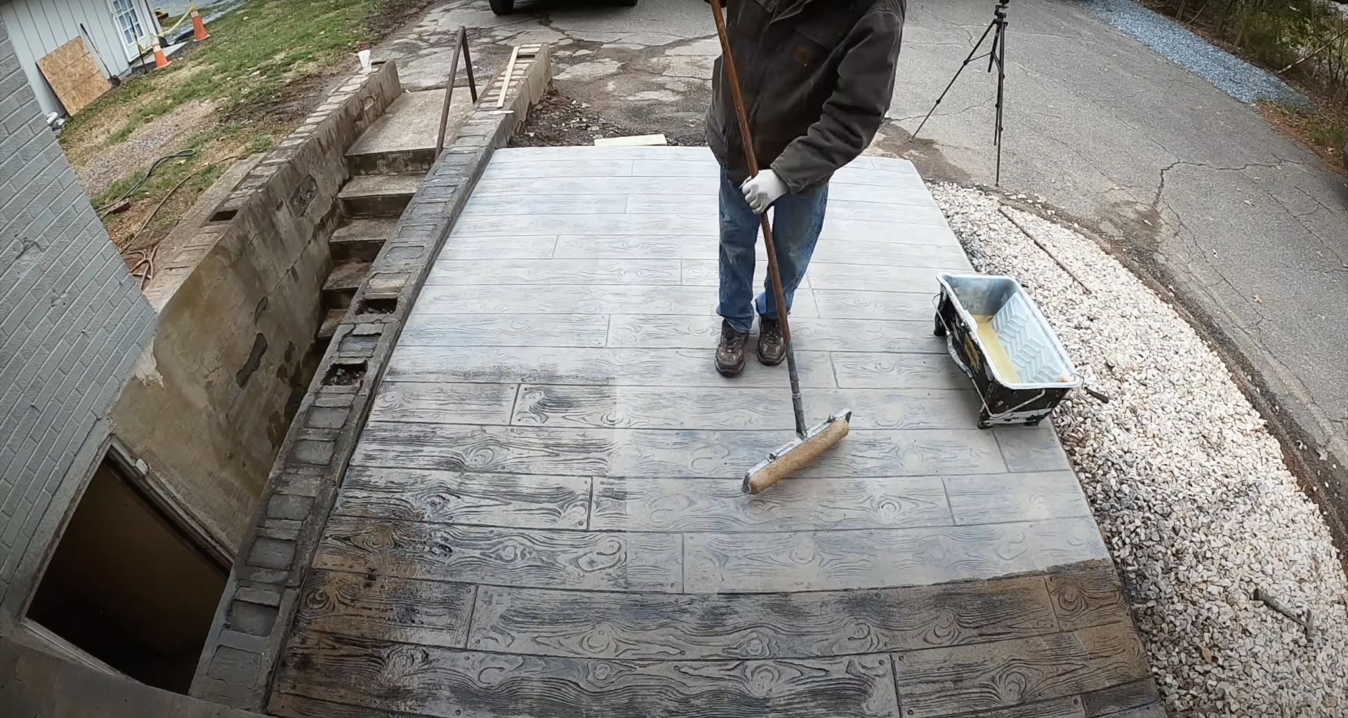 Decorative stamped concrete with realistic wood grain texture Stamped concrete with wood grain pattern being finished