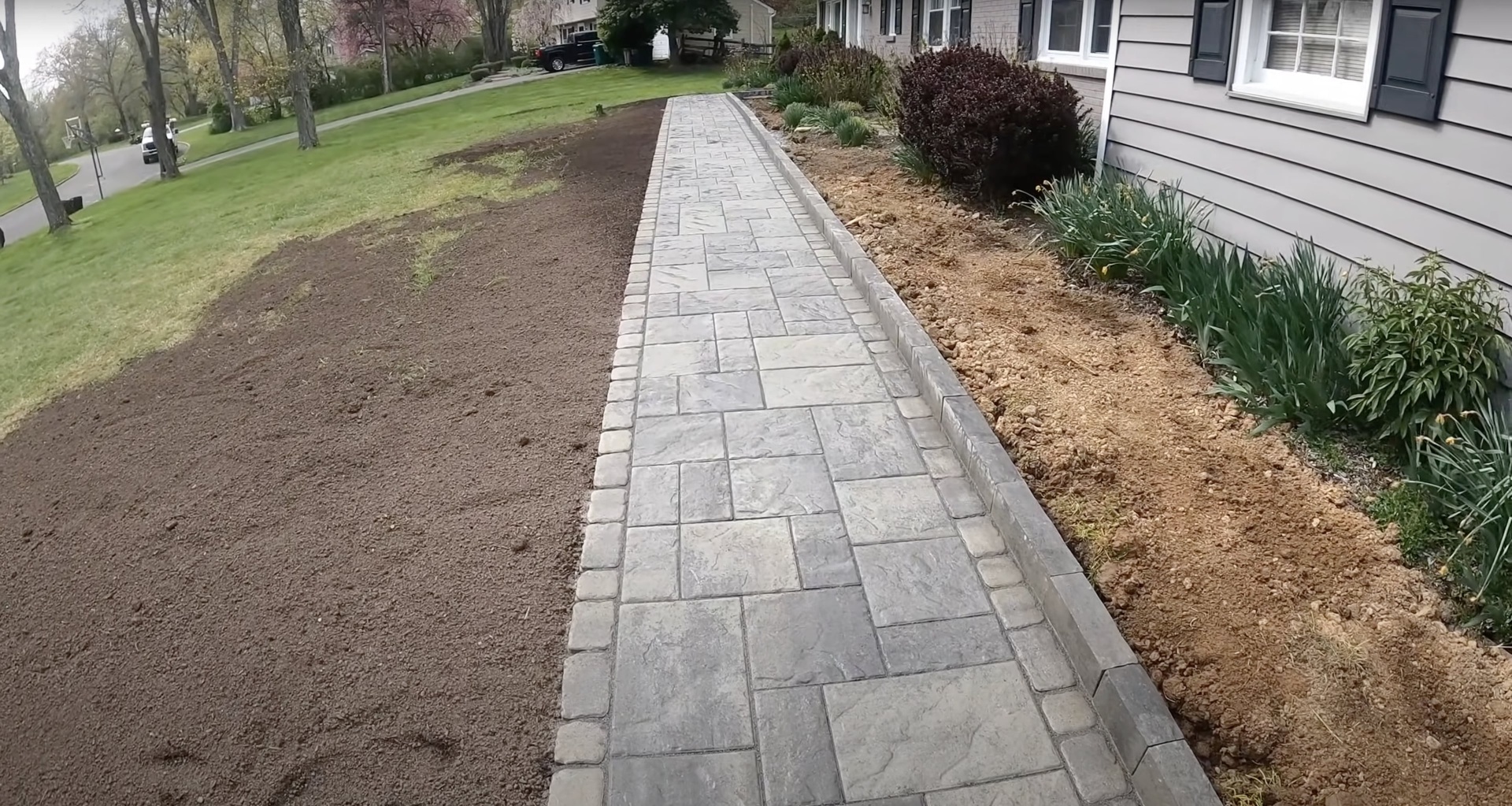 Decorative stamped concrete walkway resembling natural stone Stamped concrete walkway with natural stone pattern