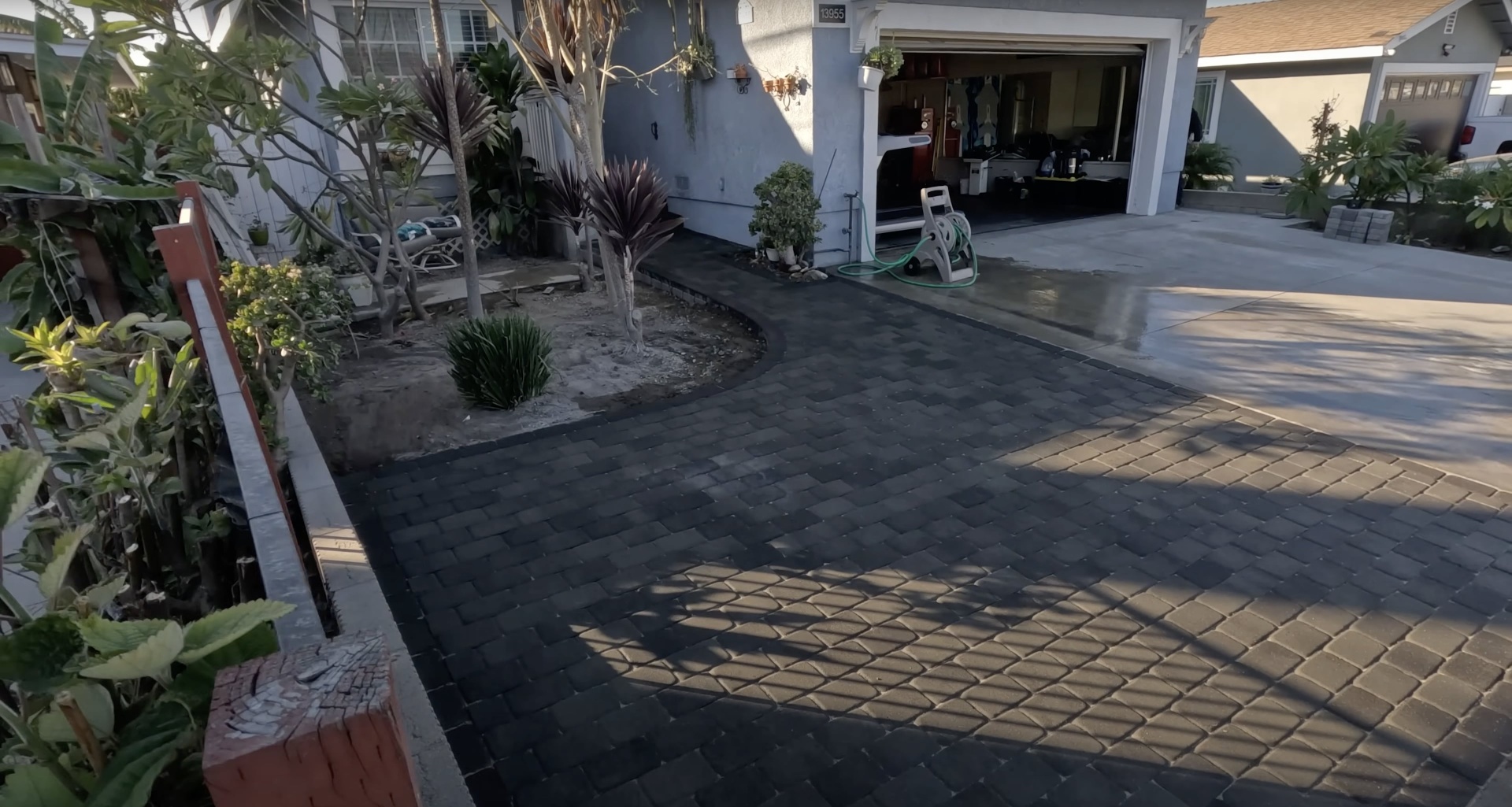 Stamped decorative concrete driveway installation Decorative stamped concrete driveway with paver pattern