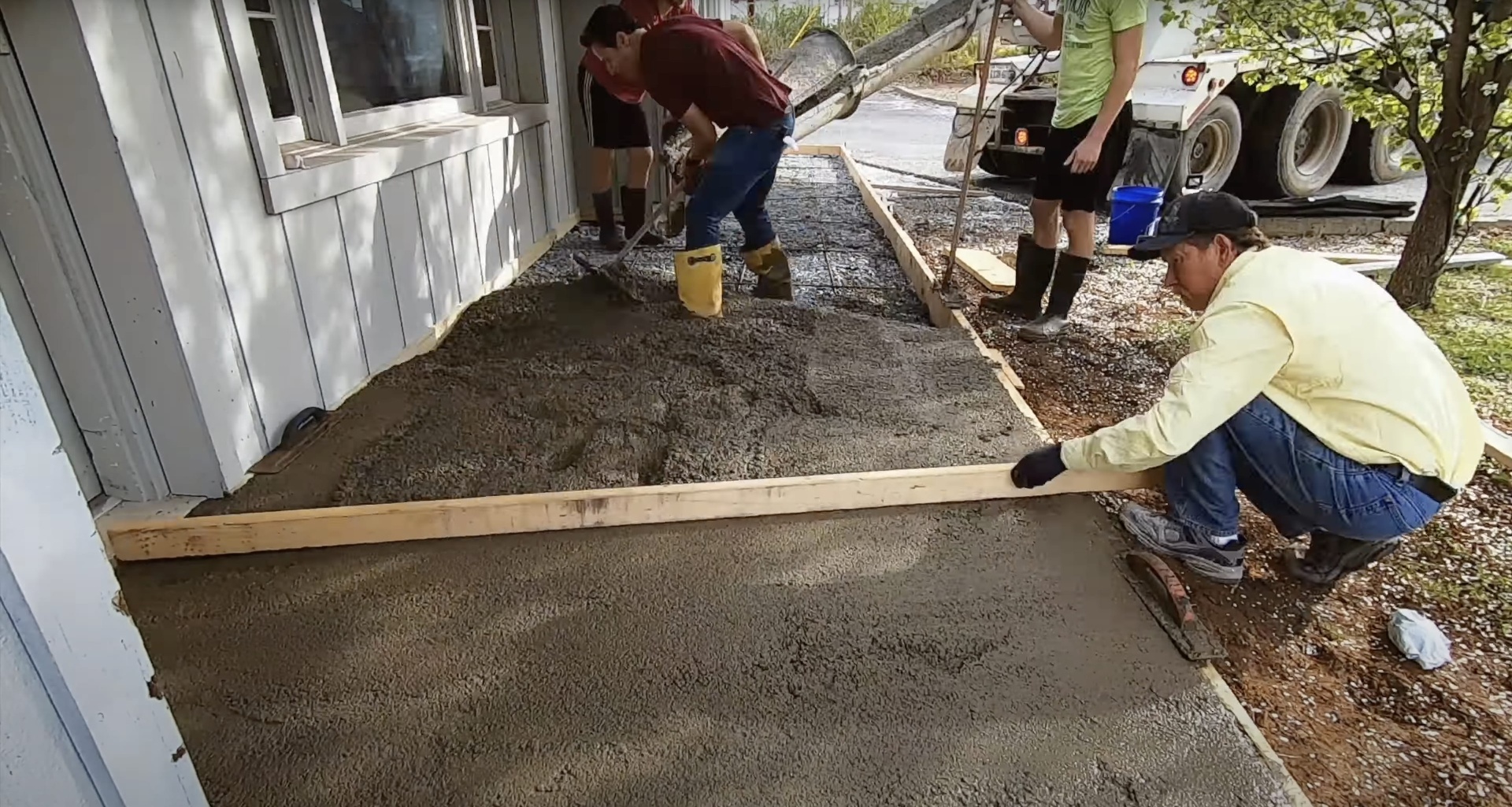 Expert concrete pouring and finishing by Sunrise Concrete Construction team Professional concrete contractors pouring and finishing concrete slab